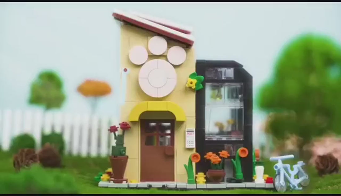 Dify Pet Book Store building block set with LED lights being built and lit up